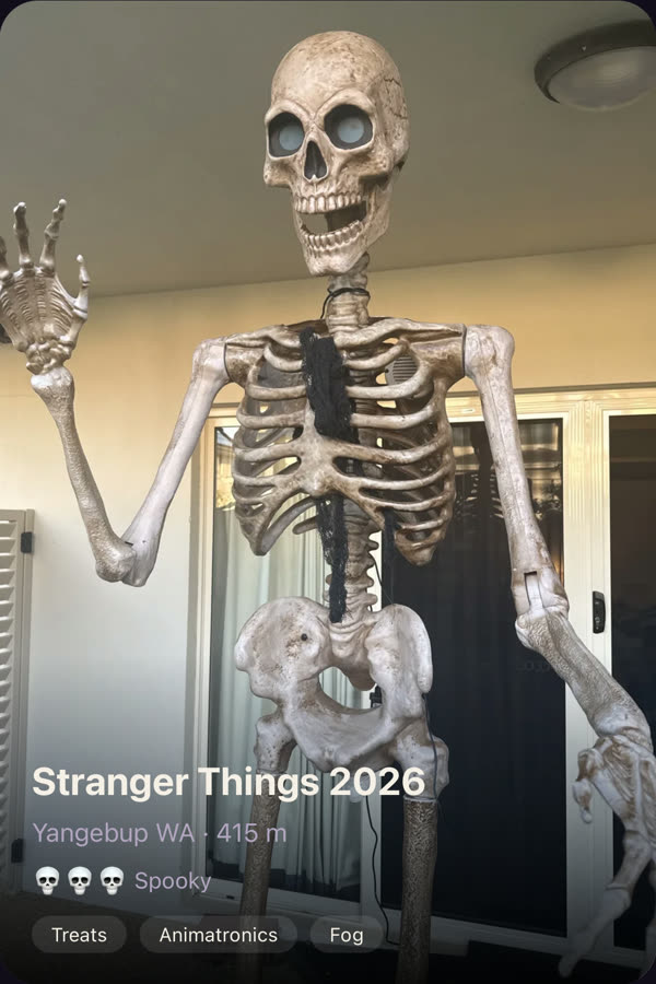 A listing on Spookaroo: a giant waving skeleton, with the house name, suburb, scare level and what's on